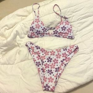 Aurelle swim size medium bikini. Never worn with tags . Purple and pink flowers